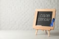 Chalkboard with blue ribbon and text Colon cancer awareness