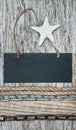 Chalkboard with chain and seashell on the old wood Royalty Free Stock Photo