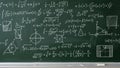 Chalkboard filled with complex mathematical equations and diagrams Royalty Free Stock Photo