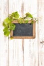 Chalkboard green vine leaves decoration wooden background Royalty Free Stock Photo