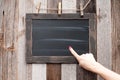 Chalkboard. Human hand pointing on blackboard.