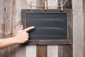 Chalkboard. Human hand pointing on blackboard.