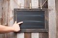 Chalkboard. Human hand pointing on blackboard.