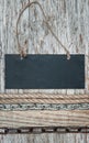 Chalkboard with metal chain on the old wood Royalty Free Stock Photo