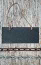 Chalkboard with metal chain on the old wood Royalty Free Stock Photo