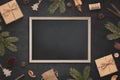 Chalkboard mockup surrounded by Christmas decorations Royalty Free Stock Photo