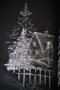 Chalkboard with painted winter village scene