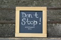 Chalkboard with phrase Don`t Stop on stone stairs outdoors Royalty Free Stock Photo