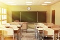 Chalkboard with Rows of Wooden Lecture School or College Desk Ta