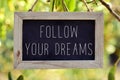 Chalkboard with the text follow your dreams