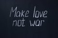 Chalkboard text Make love not war. Life-affirming and pacifist lettering