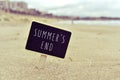 Chalkboard with the text summers end in a beach Royalty Free Stock Photo