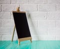 Chalkboard in wooden frame. Empty stand mockup menu frame