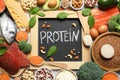 Chalkboard with written word Protein among natural food Royalty Free Stock Photo