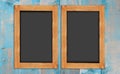 Chalkboards on the wood wall Royalty Free Stock Photo