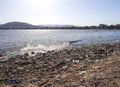 Chalkida, Evia island. July 2019: Panoramic view of the city beach of Liani Ammos with tourists and Gypsies, polluted with garbage