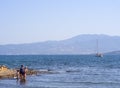 Chalkida, Evia island. July 2019: Panoramic view of the city beach of Liani Ammos with tourists and Gypsies, polluted with garbage