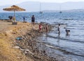 Chalkida, Evia island. July 2019: Panoramic view of the city beach of Liani Ammos with tourists and Gypsies, polluted with garbage