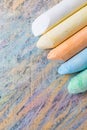 Chalks with colorful painted background Royalty Free Stock Photo