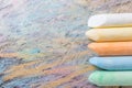 Chalks with colorful painted background Royalty Free Stock Photo