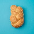 Challah bun on blue background.