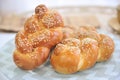 Challah or Hala is a traditional jewish sweet fresh sabbath bread loaf, fresh bun on cutting board