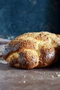 Challah or Hala is a traditional jewish sweet fresh sabbath bread loaf, fresh bun on cutting board. Brioche bread on breakfast