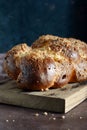 Challah or Hala is a traditional jewish sweet fresh sabbath bread loaf, fresh bun on cutting board. Brioche bread on breakfast