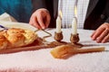 Challah or Hala is a traditional jewish sweet fresh sabbath bread loaf. Hands of men keep bread.