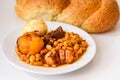 Challah Shabbat bread and hamin or cholent in hebrew - Sabbath traditional food on white table in the kitchen.