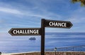 Challenge or chance symbol. Concept word Challenge or Chance on beautiful signpost with two arrows. Beautiful blue sea sky with Royalty Free Stock Photo