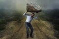 Challenge concept. Man with boulder Royalty Free Stock Photo