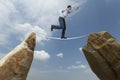 Challenge concept. Man walking on wire Royalty Free Stock Photo