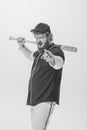 Challenge. Thrilled male baseball player wearing retro sports uniform and holding bat isolated on white background