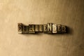 CHALLENGED - close-up of grungy vintage typeset word on metal backdrop