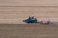A Challenger MT 865 E tractor pulls the disc harrow through the field to prepare the soil Royalty Free Stock Photo