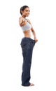 Challenging you to lose the flab. A gorgeous young woman in an oversized pair of pants pointing at you.