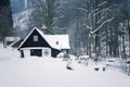 Cottage in snowy mountains country, foggy winter day, Czech republic