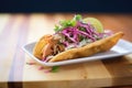 chalupa with pulled pork and red onions Royalty Free Stock Photo