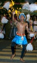 A Chamara Dancer performs along the streets of Kandy during the Esala Perahara in Sri Lanka.