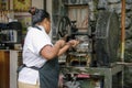 Chamarel, Mauritius Island- 5 th March 2020: Native woman making sugar cane juice on the traditional machine