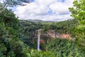 Chamarel Waterfall cascading into rocky crater, Mauritius Royalty Free Stock Photo