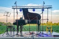 Chamber music in nature. A stage with a piano set in a agriculture field Royalty Free Stock Photo