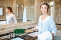 Chambermaid in the hotel bathroom