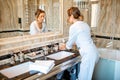 Chambermaid in the hotel bathroom