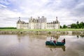 CHAMBORD, FRANCE -MAY 29: Family on a boat in front of the chateau Chambord on May 29, 2014. Chambord is royal medieval french ca