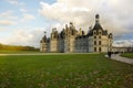 Chambord palace after rain at sunset, Loire Valley, France Royalty Free Stock Photo