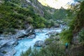 Chame - A girl hiking throÅgh a Himalayan Valley