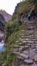 Chame - A girl hiking up the stairs along the river