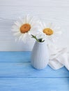 Chamomile bouquet shawl of a blossom plant vase retro textile on a wooden arrangement background, fabric